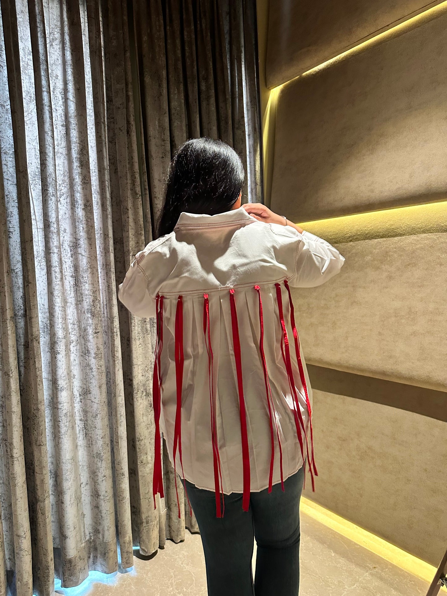TASSLE STATEMENT SHIRT