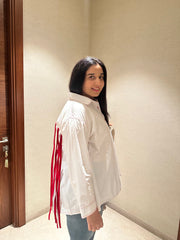 TASSLE STATEMENT SHIRT